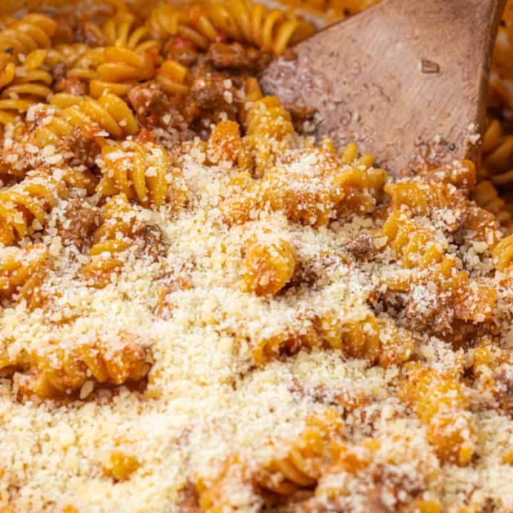 beef pasta with parmesan sprinkled ontop