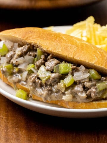 Ground Beef Philly Cheese Steak on a plate with chips