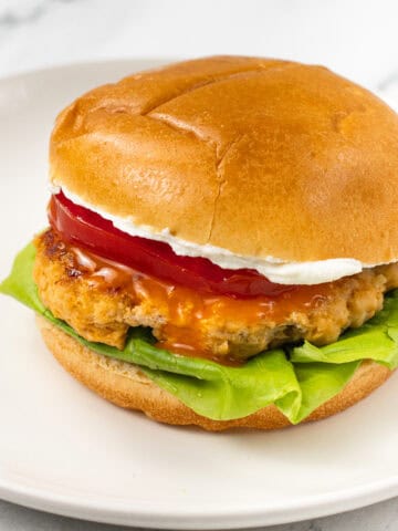 finished burger Buffalo Ground Chicken Burger with Whipped Goat Cheese